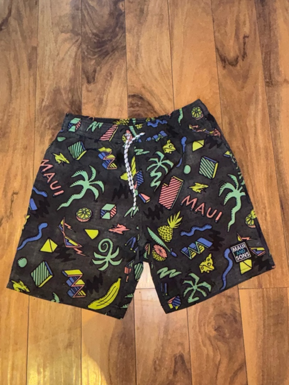 Maui and Sons Black Swim Shorts with Neon Tropical Print
